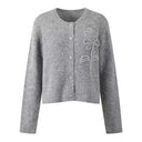 Solid Rose Accent O-Neck Long Sleeve Knit Cardigan